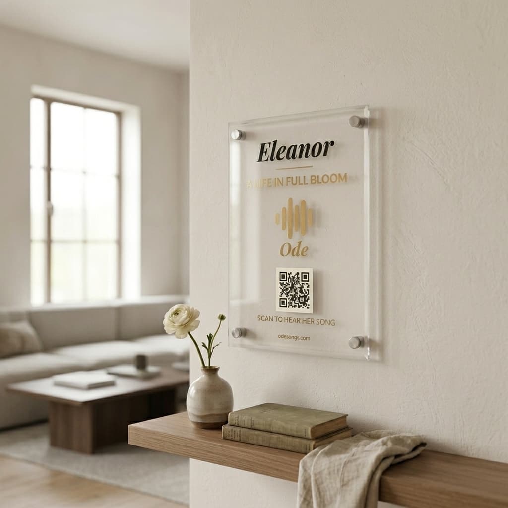 Personalized acrylic lyric plaque with name, waveform, and scannable QR code mounted on a wall
